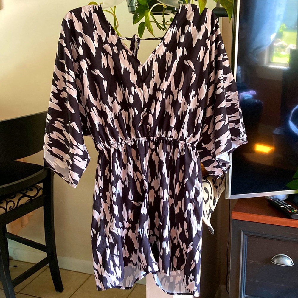 NWOT. One piece shorts playset with elastic waist, V-neck, and tie back.